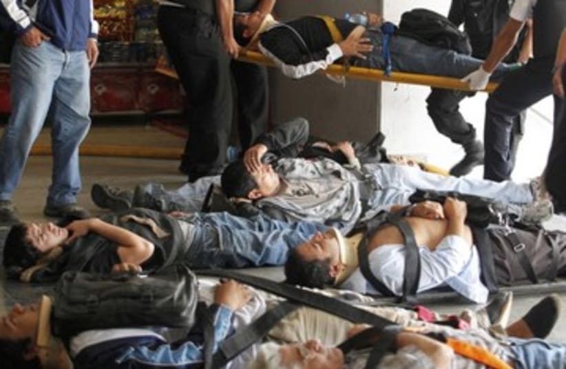 Vicitms in Argentine train crash_390 (photo credit: Enrique Marcarian/Reuters)