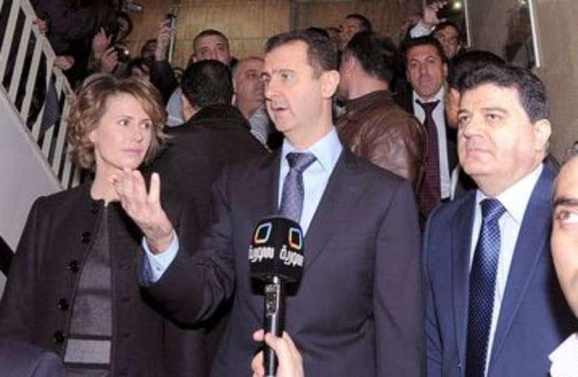 Syrian President Bashar Assad at polling station 390 (R) (photo credit: REUTERS/SANA)