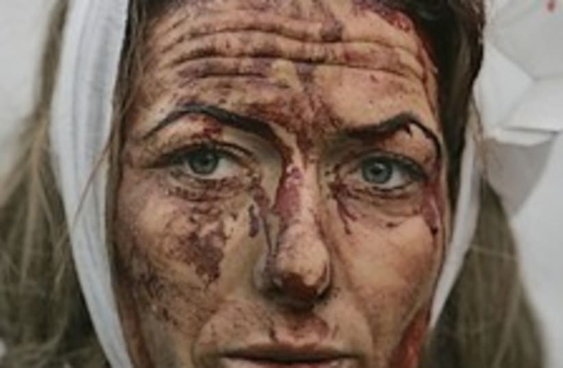woman hurt kassam sderot (photo credit: AP)