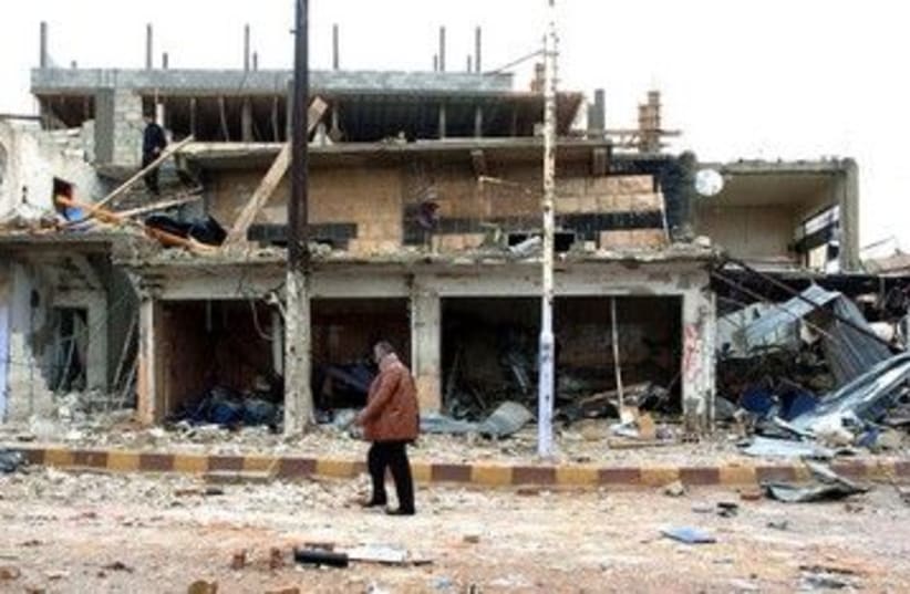 The site of a blast in Syria's Deraa 390 (R) (photo credit: REUTERS/SANA/Handout)