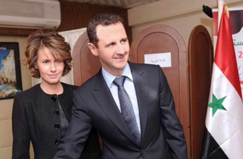 Syria Asma Assad and Bashar Assad vote 390 (photo credit: REUTERS)