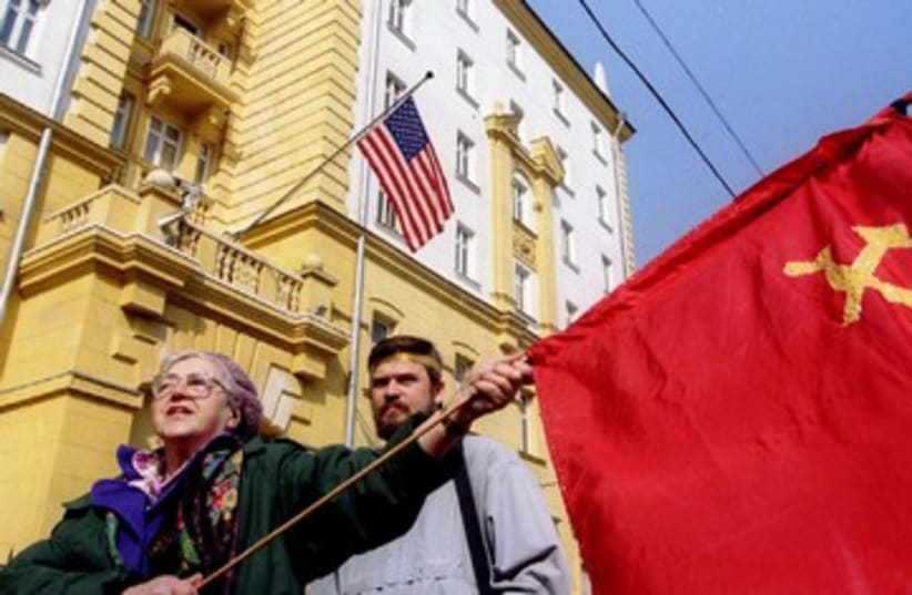 Soviet sympathizers wave flag 390 (photo credit: REUTERS)