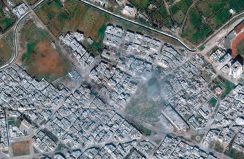 Satellite images of Homs 390 (photo credit: Reuters)