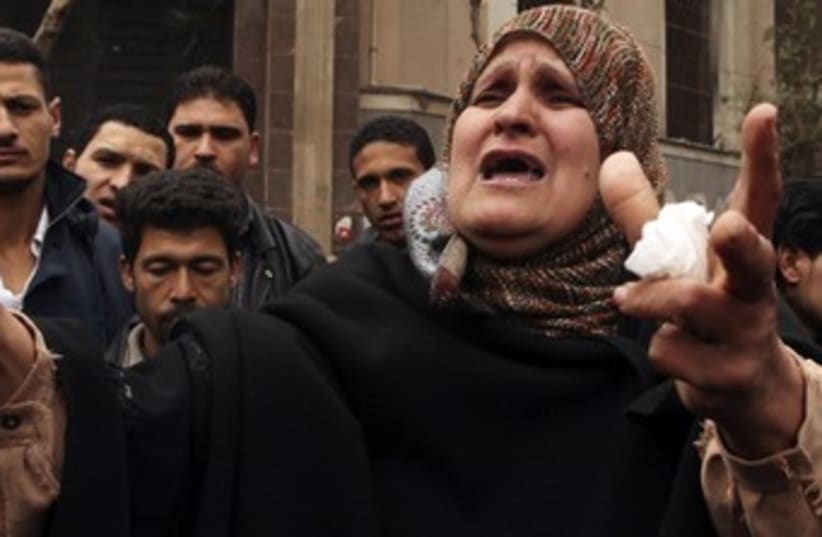 Woman shouts about political situation (photo credit: Reuters/Mohammed Salem)