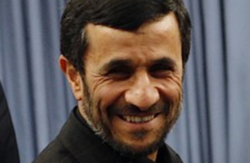 Ahmadinejad smiles 224.8 (photo credit: AP)