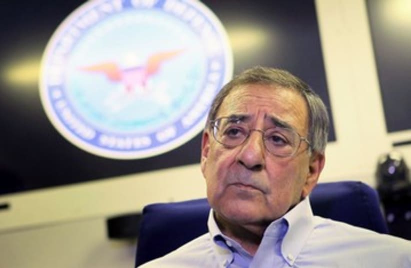 Leon Panetta speaks with reporters on a plane 390 (R) (photo credit: REUTERS/Scott Olson/Pool)