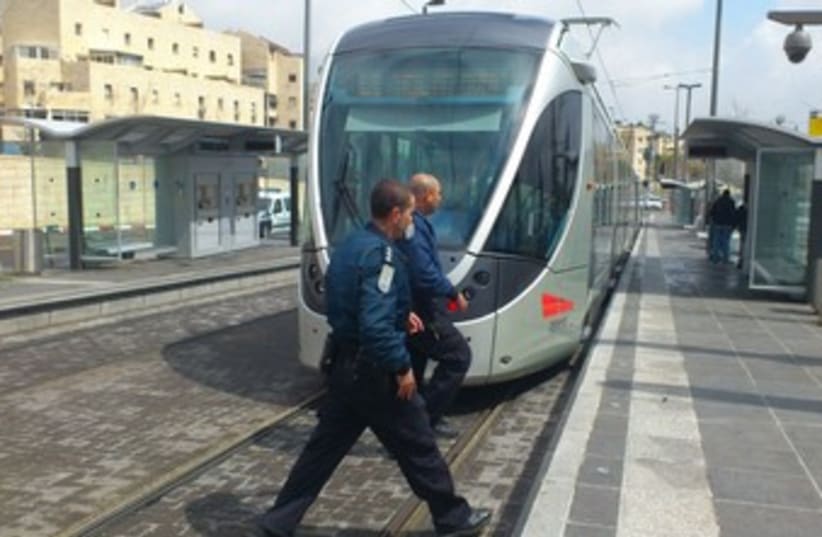 police circle Jerusalem light rail_370 (photo credit: Melanie Lidman)