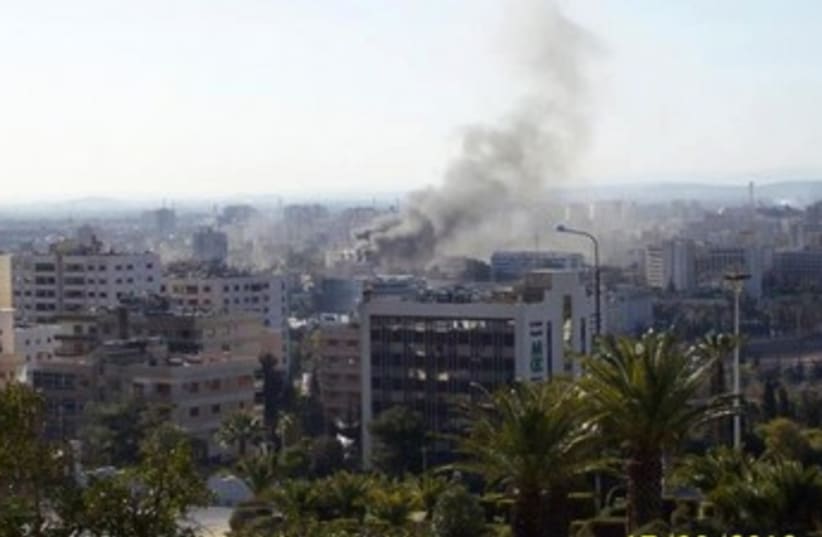 Smoke rises in Damascus 370 (photo credit: REUTERS)