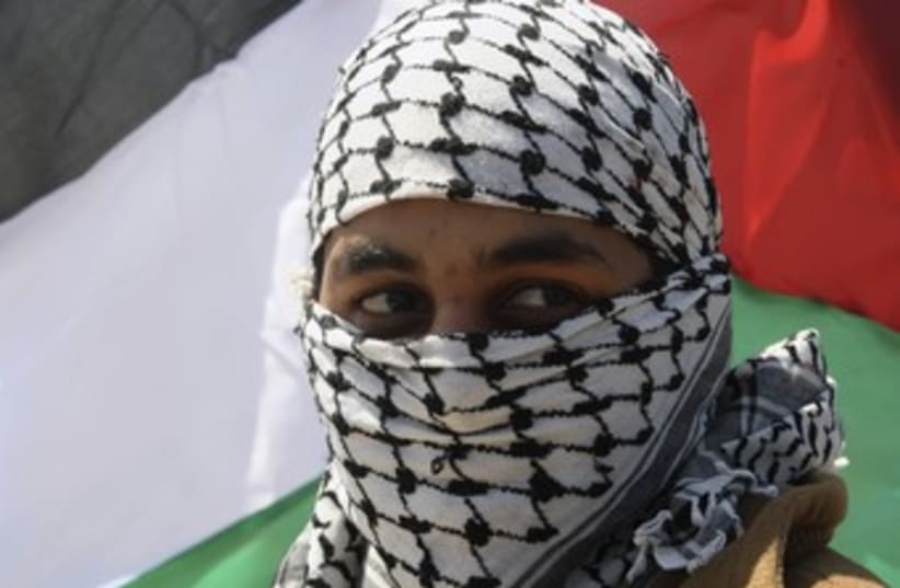 Palestinian at Land Day rally in Gaza City 370 (R) (photo credit: Ismail Zaydah / Reuters)