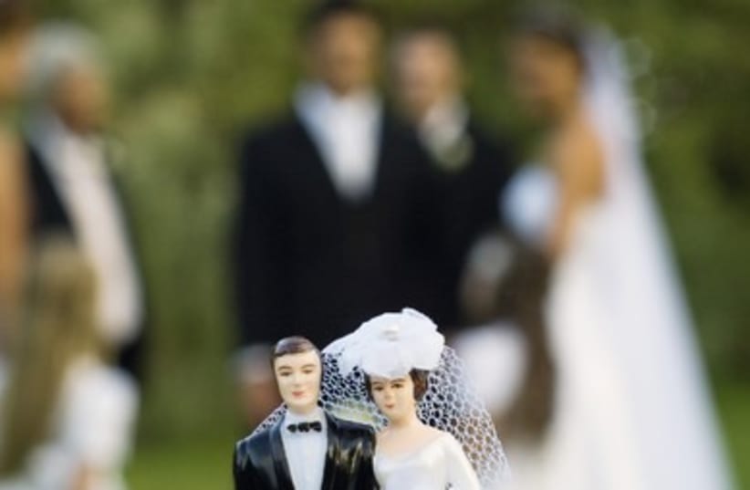 Wedding with blurred background (photo credit: Thinkstock/Imagebank)