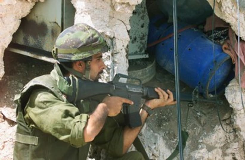 IDF soldier in Jenin during Operation Defensive Shield 390 R (photo credit: REUTERS)
