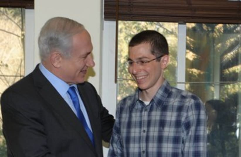 PM Netanyahu and Gilad Schalit in Tel Aviv 370 (photo credit: Moshe Milner / GPO)
