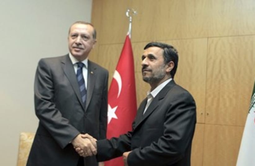 Iranian President Ahmadinejad with Turkish PM Erdogan 370 R (photo credit: REUTERS)