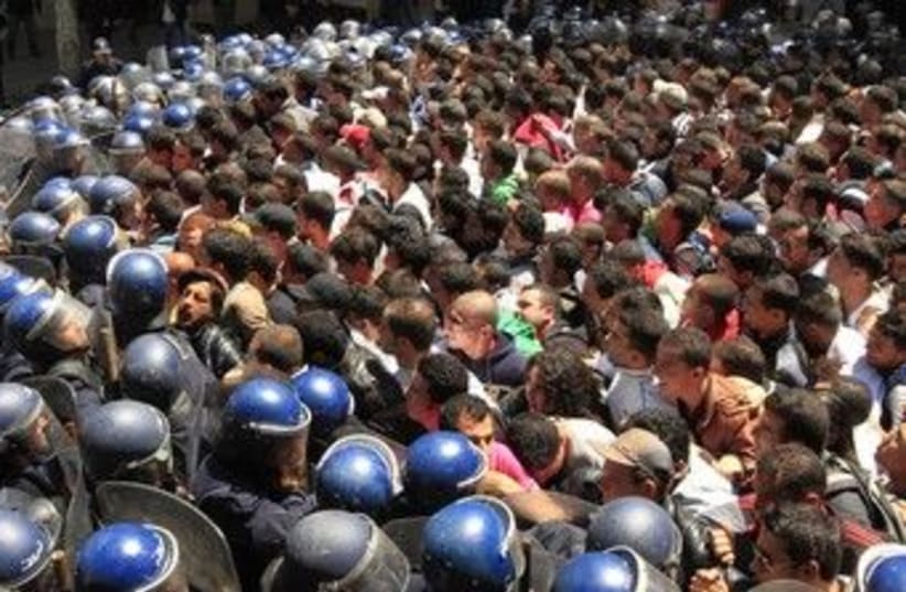 Algerian riot police prevent a demonstration 370 (R) (photo credit: REUTERS/Zohra Bensemra)
