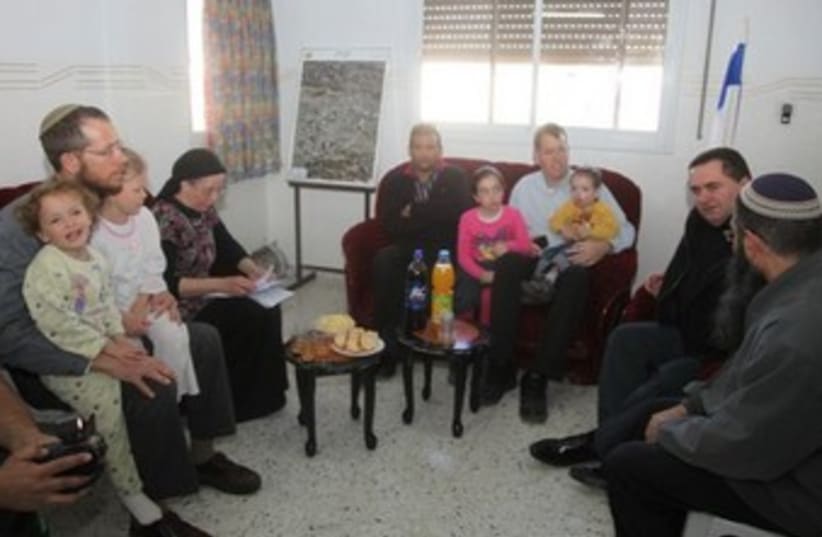 Families with Transport Minister Yisrael Katz in Hebron home (photo credit: TOVAH LAZAROFF)