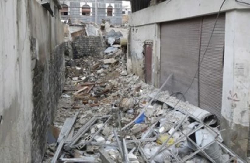 Damage rubble in the old city of Homs_370 (photo credit: Reuters)