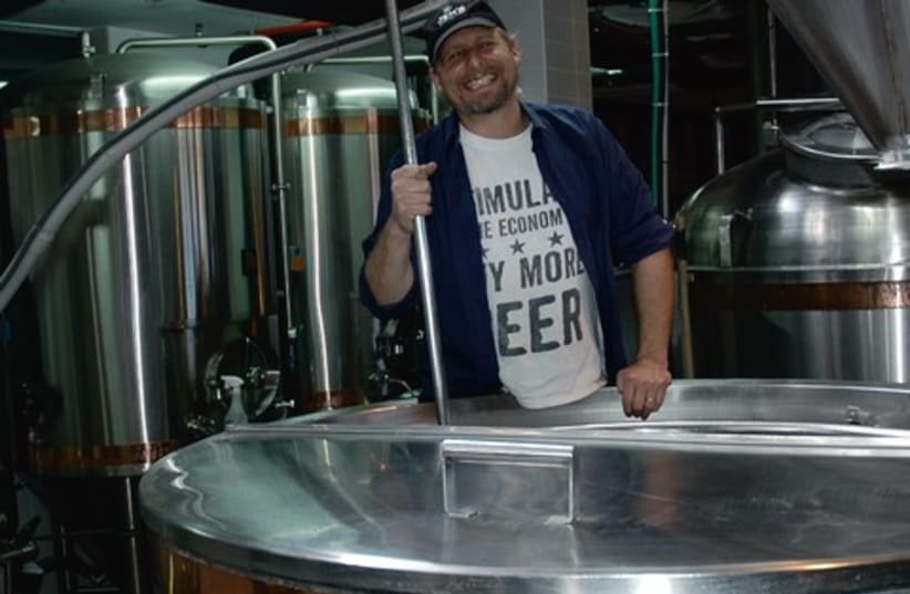 Jeremy Welfeld brewing beer (photo credit: Marian Lebor)