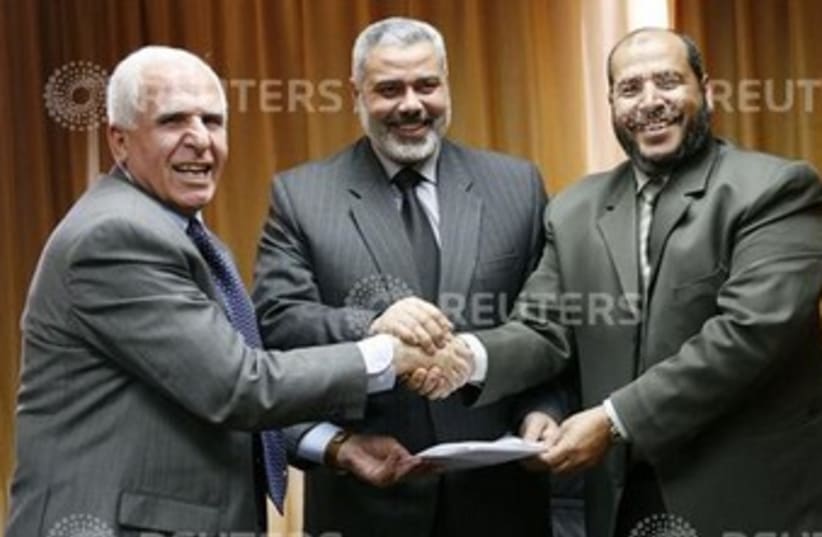 DEPUTY PALESTINIAN Prime Minister Azzam al-Ahmed (left) (photo credit: Suhaib Salem / Reuters)