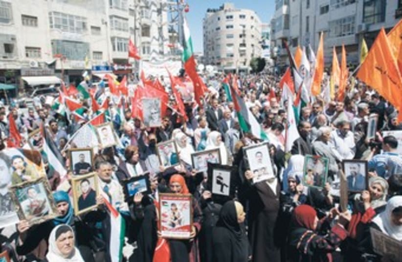 PALESTINIANS RALLY in Ramallah for Prisoners Day 370 (photo credit: Mohamad Torokman/Reuters)