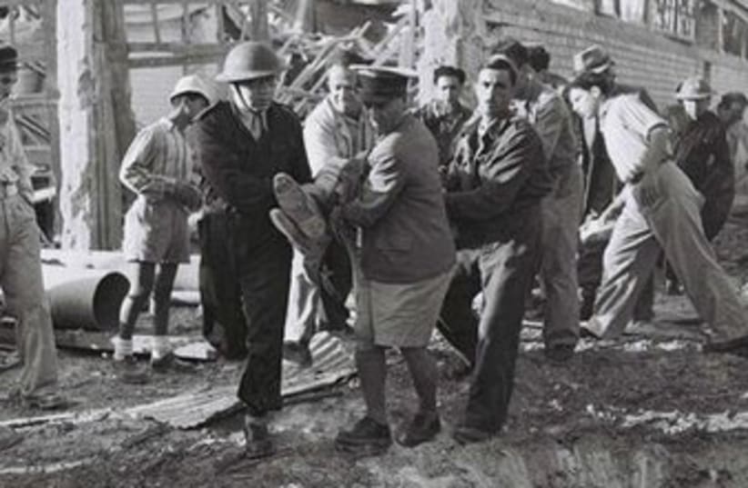 Haganah volunteers evacuate wounded 370 (photo credit: State of Israel National Photo Collection)