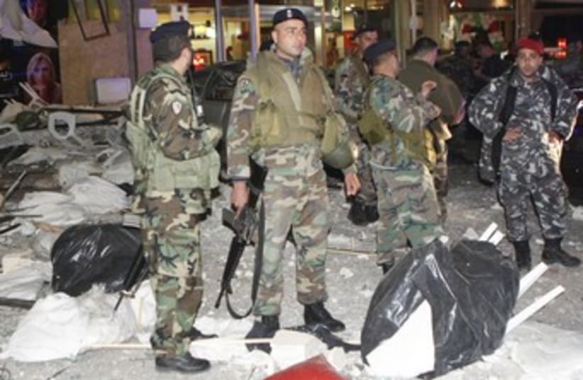 Lebanese soldiers at bombed Tyre restaurant_370 (photo credit: Haidar Hawila/Reuters)
