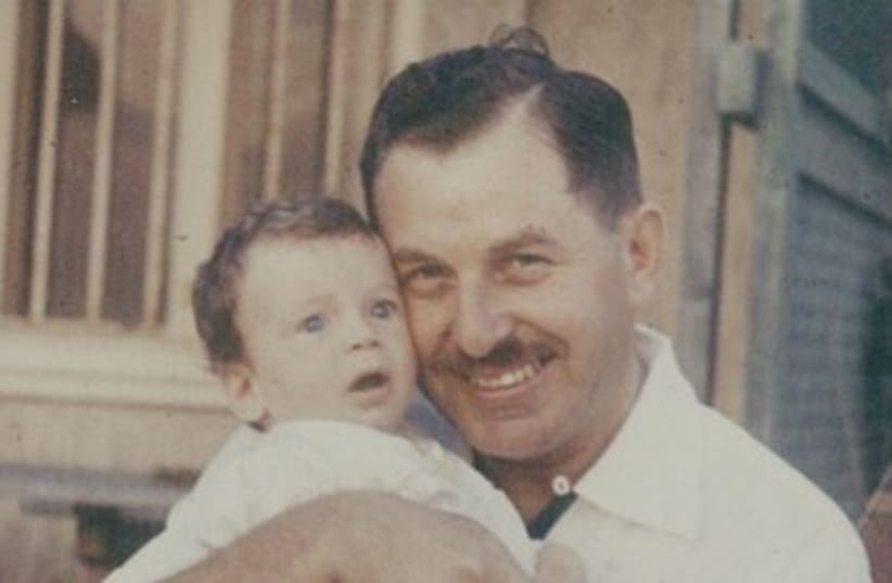 Isaac Herzog as a baby with his father, Chaim Herzog in 1960 (photo credit: Courtesy Herzog family)