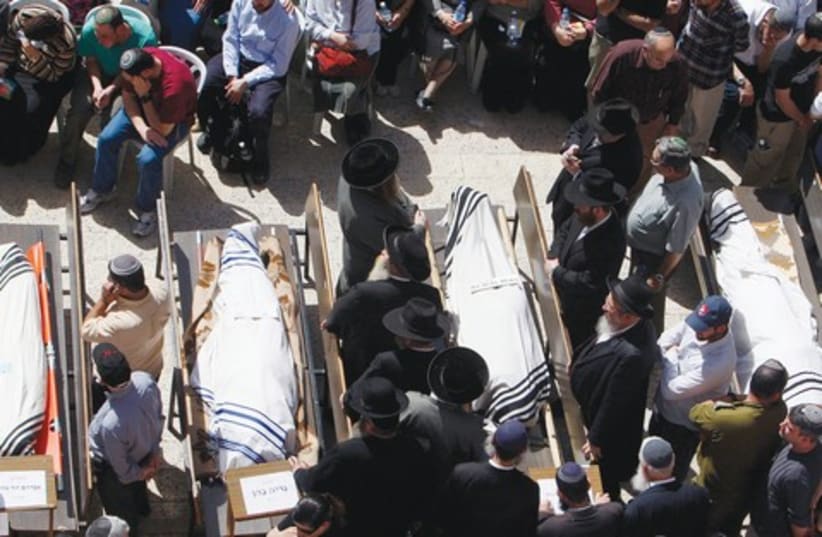 Funeral for victims of Merkaz Harav shooting 521 (photo credit: Reuters)
