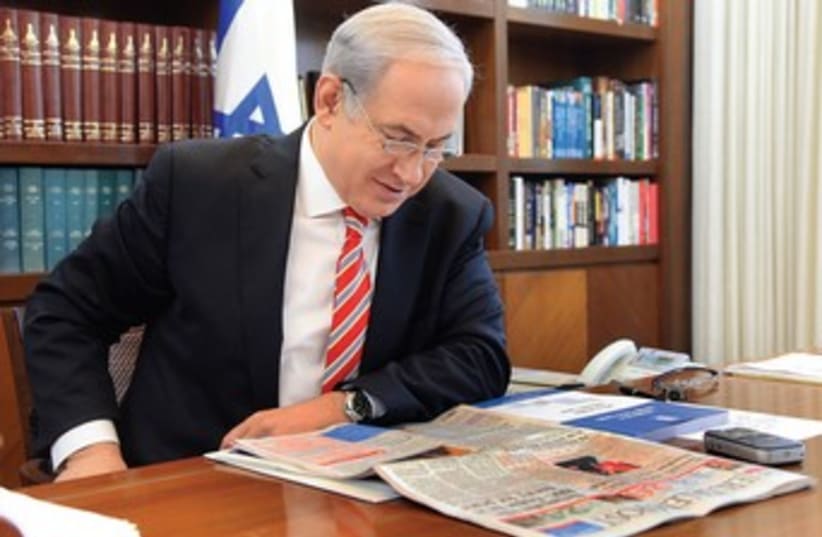Prime Minister Netanyahu reads Jerusalem Post (photo credit: Illustrative Photo )
