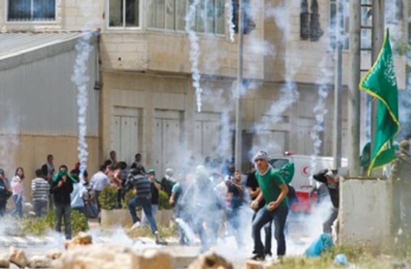 Arabs riot near Ofer Prison 370 (photo credit: Mohamad Torokman/Reuters)