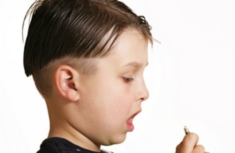 Boy taking medicine 370 (photo credit: Thinkstock/Imagebank)