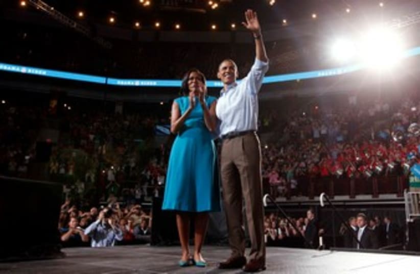 Barack Obama with wife at Ohio rally 370 (photo credit: REUTERS/Kevin Lamarque )