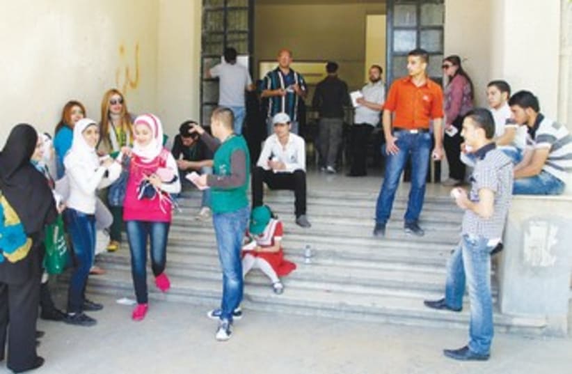 polling station in Damascus_370 (photo credit: Reuters)