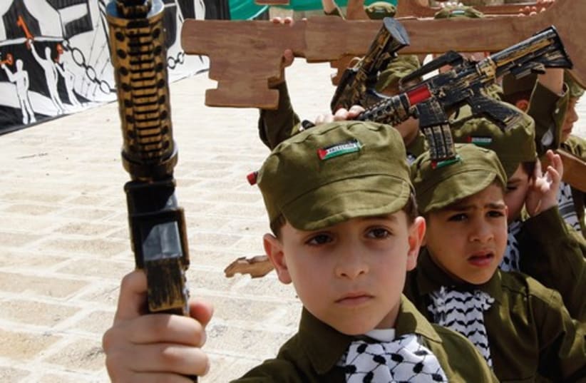 Palestinian children dressed as soldiers 521 (photo credit: Reuters)