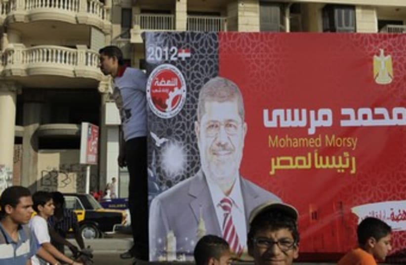  Supporters of Mursi, head of Brotherhood political party 37 (photo credit: REUTERS)