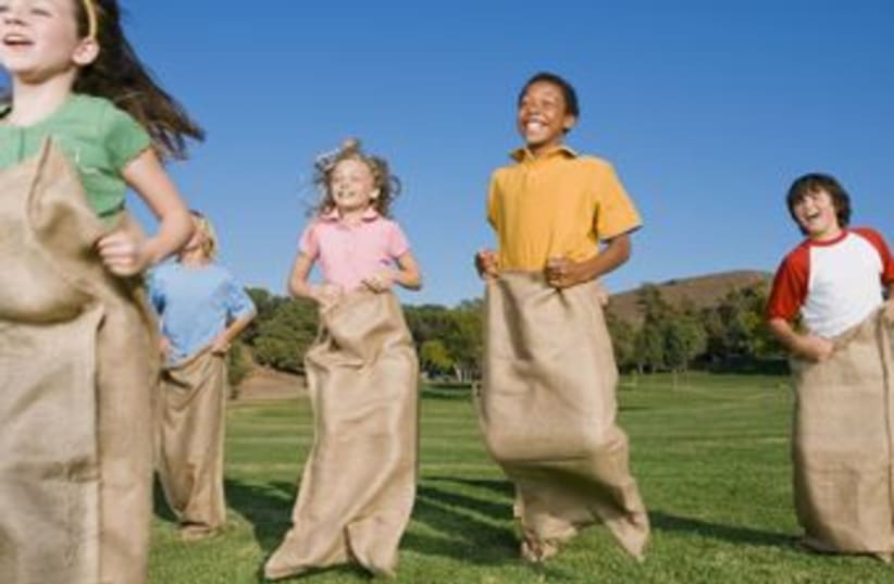 Kids engaging in physical education (photo credit: Thinkstock)