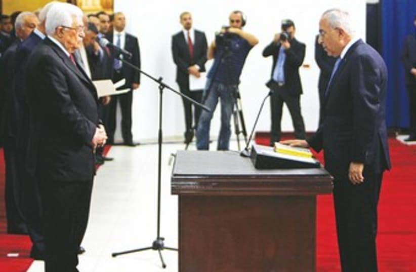 PA PRIME MINISTER Salam Fayyad sworn in 370 (photo credit: Mohamad Torokman/Reuters)