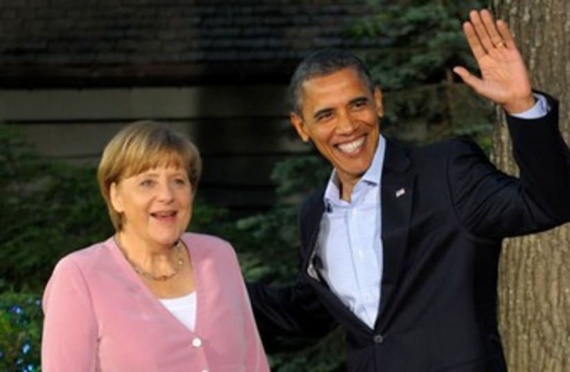 Obama greets Merkel at G8 370 (photo credit: REUTERS/Philippe Wojazer )