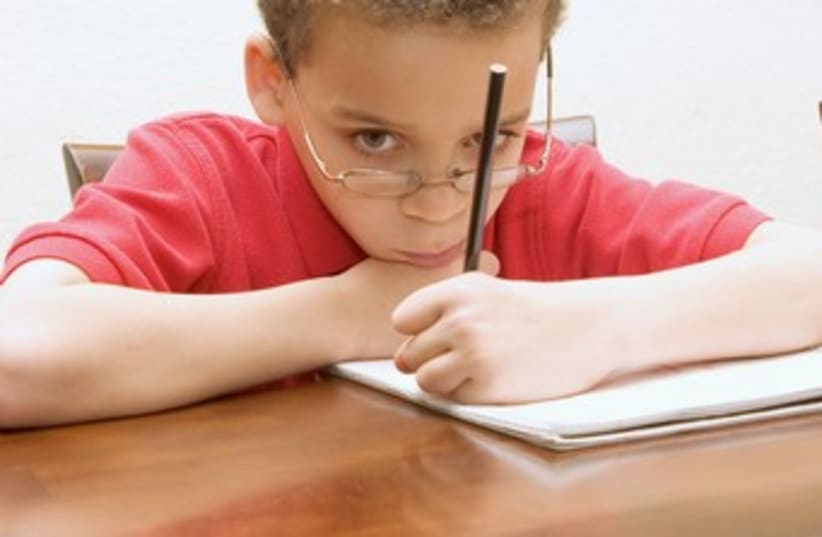 Boy reluctant to do his homework 370 (photo credit: Thinkstock/Imagebank)
