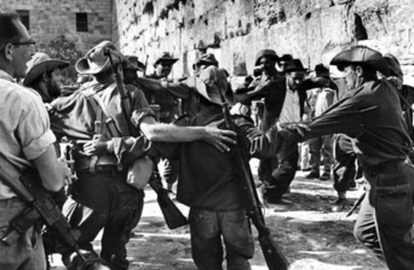 IDF soldiers celebrate at the Western Wall in 1967_370 (photo credit: Courtesy Werner Braun/Jerusalem Post Archives)