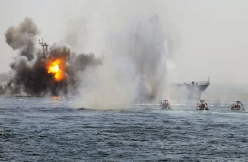 Iranian warship, speed boats in Hormuz war game 370 (photo credit: REUTERS/Fars News)