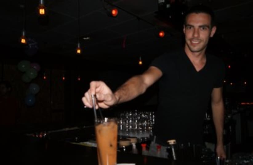 Barman at Evita 370 (photo credit: Yoni Cohen)