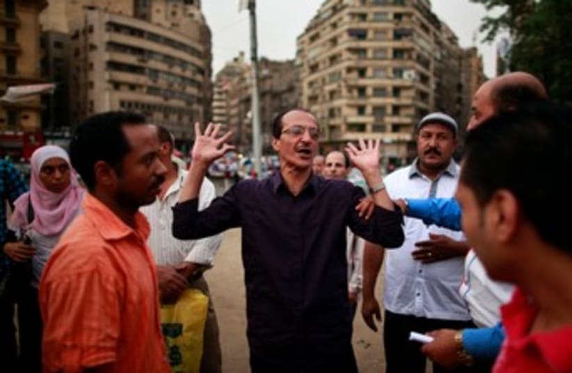 Egyptians argue elections in Tahrir Square 370 (photo credit: REUTERS)