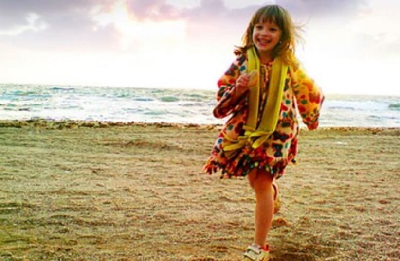 girl running on beach (photo credit: Tom Langford)