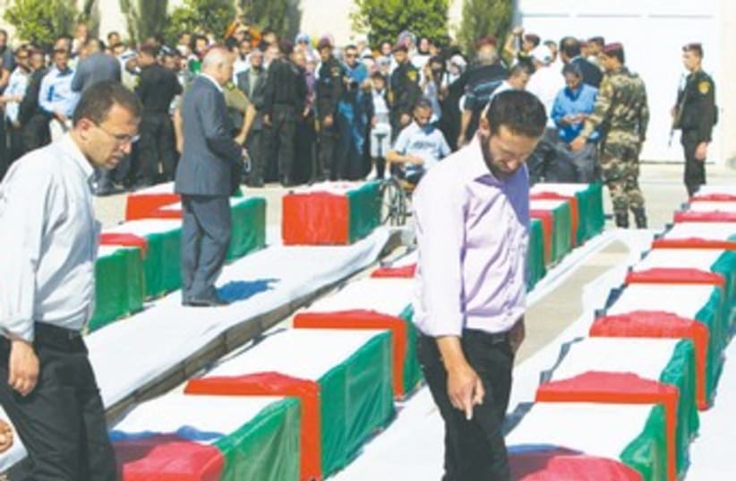 PA honors terrorists whose bodies returned 370 (photo credit: REUTERS)