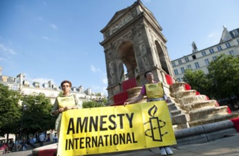 Amnesty International activists 370 (photo credit: REUTERS/Julien Muguet)