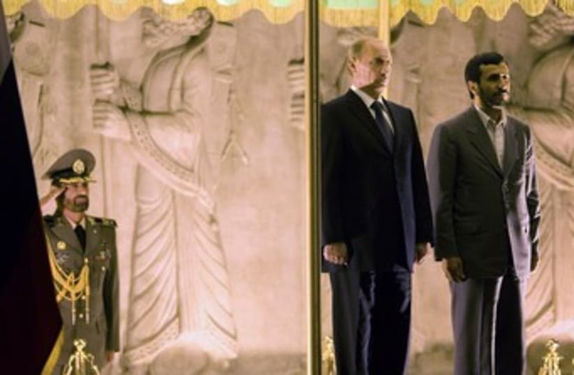 Russia's Putin with Iran's Ahmadinejad 370 (photo credit: 	 REUTERS/Morteza Nikoubazl)