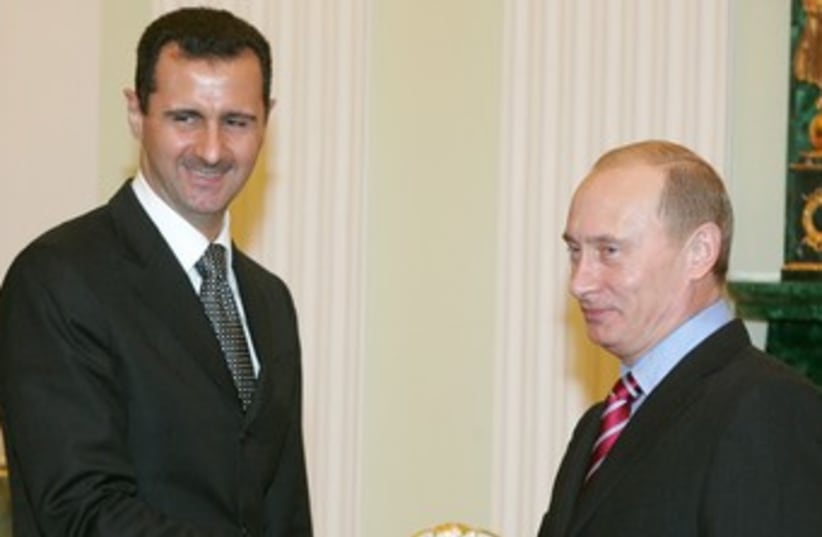 Assad and Putin 370 (photo credit: REUTERS/FILE)