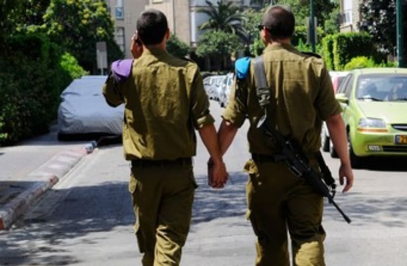 Two male soldiers holding hands in TA 370 (photo credit: IDF)