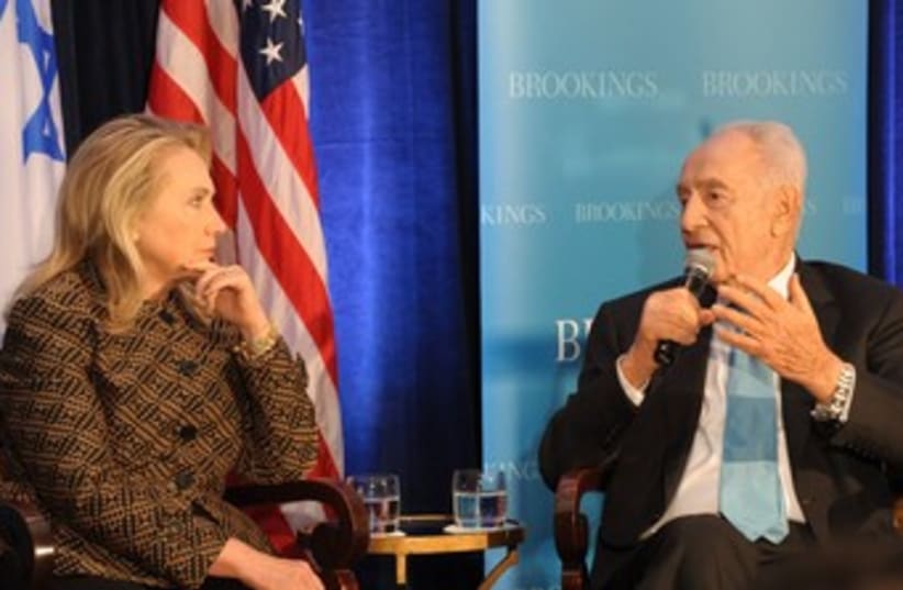President Peres and US Secretary of State Clinton 370 (photo credit: Amos Ben Gershom / GPO)