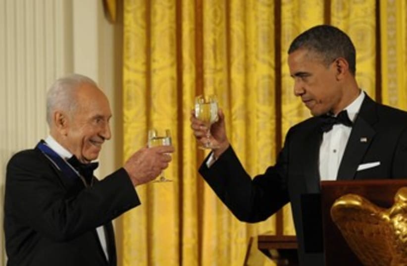 President Peres, US President Obama toast  370 (photo credit: Amos Ben Gershom/ GPO)